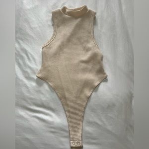 Forever 21, size small, beige nude bodysuit. Never used, tag still on it.